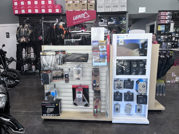 Parts and accessories display shelf inside the Fastback Moto shop